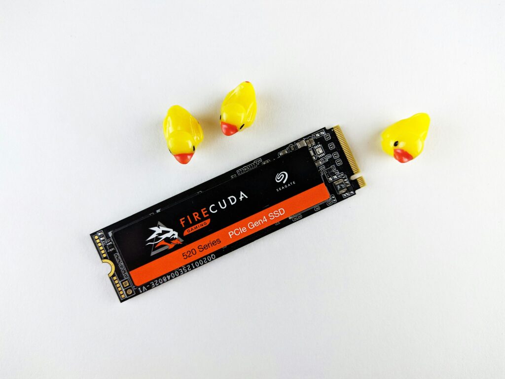 Image on an NVMe Solid State Drive with three yellow plastic dock around it