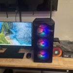New gaming computer build in Fresno with picture of gaming PC, monitor and parts boxes